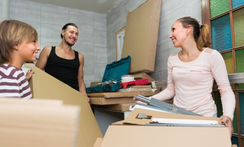 Professional office relocation planning in Balham with moving boxes and desks