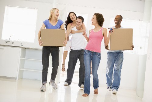Removal team preparing a flat move in Balham with boxes and furniture