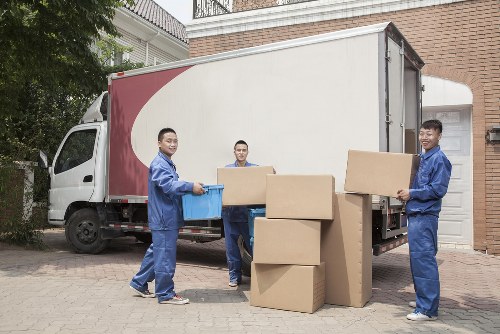 Professional flat removals planning in Balham with packed boxes and moving van