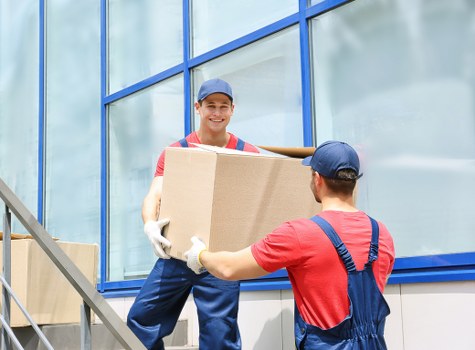 Movers preparing equipment safely before a house removal