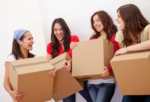 Packed office boxes and furniture ready for Balham office removals