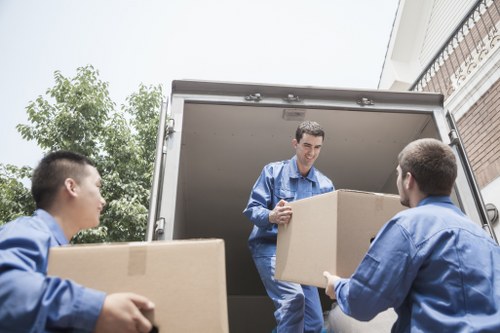 Packed boxes ready for house removals in Balham inside a living room