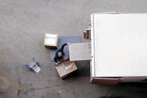 Professional movers carrying boxes during a Balham same day move