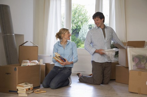 Removal team organising boxes and furniture for a South London relocation